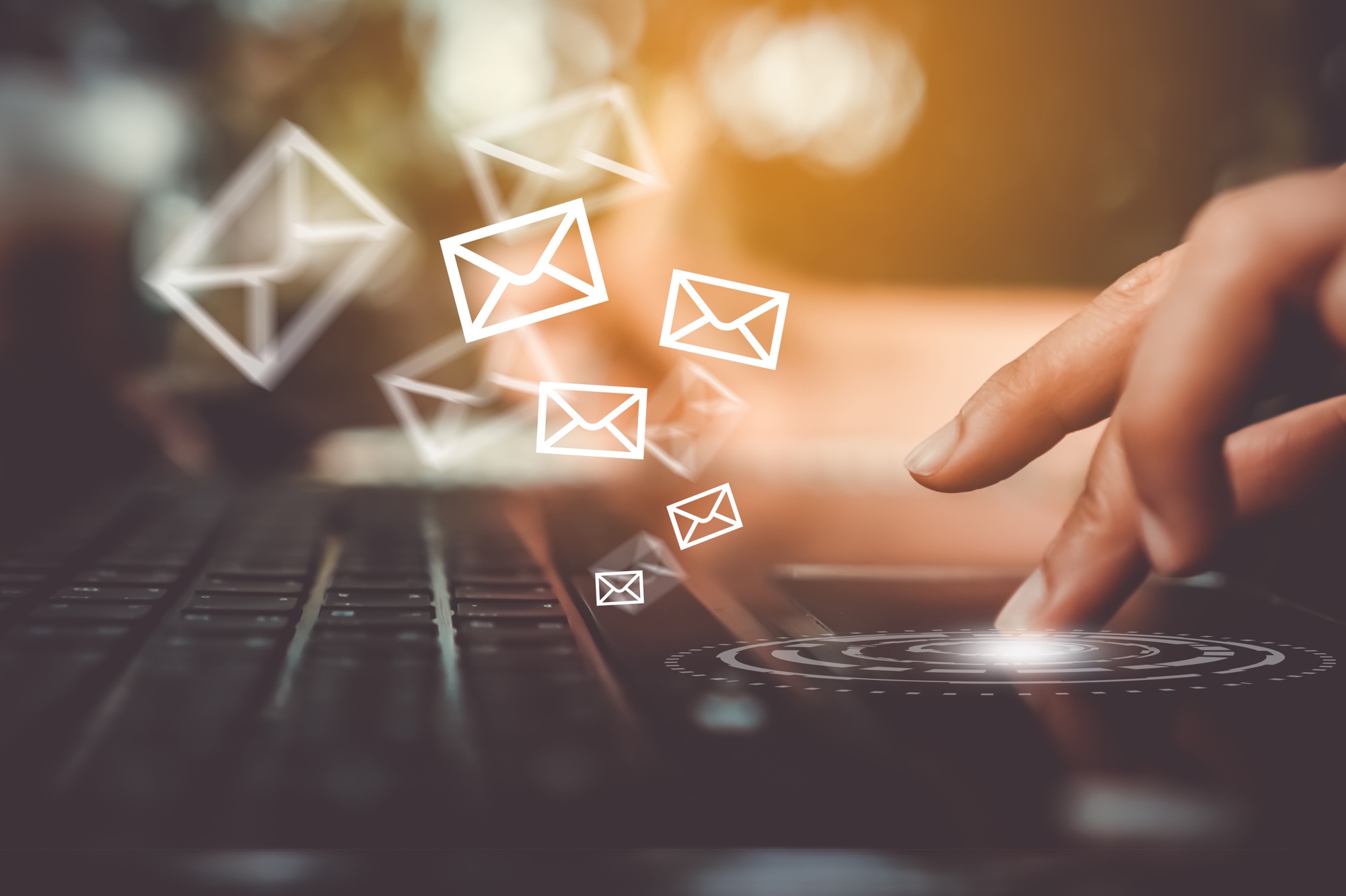 Picture of person at computer sending email