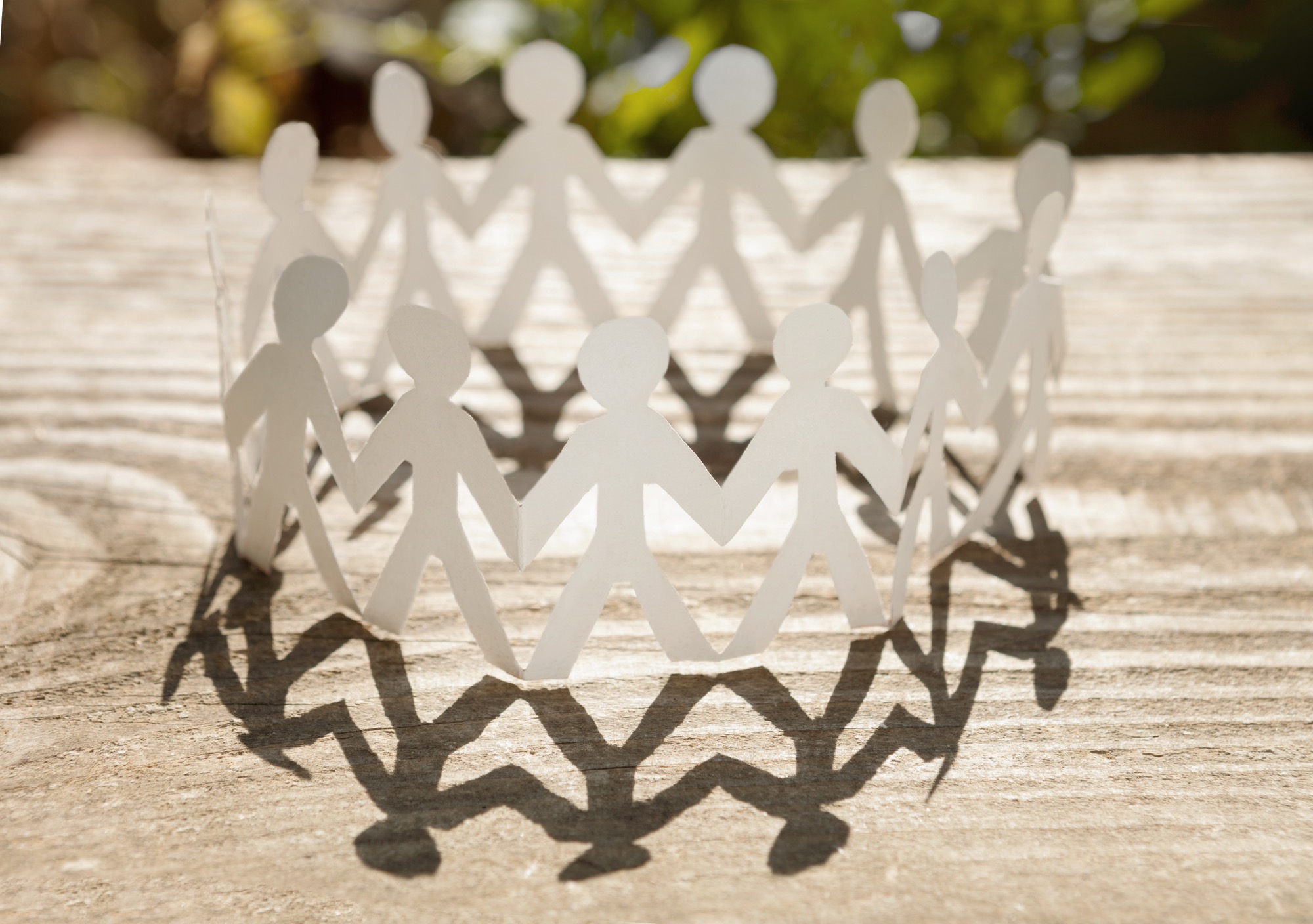 Picture of paper people holding hands