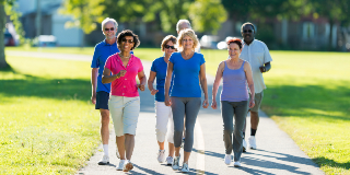 A group of walkers on a paved trail