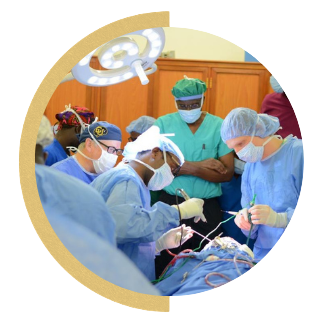 Physicians operating in an OR in Uganda
