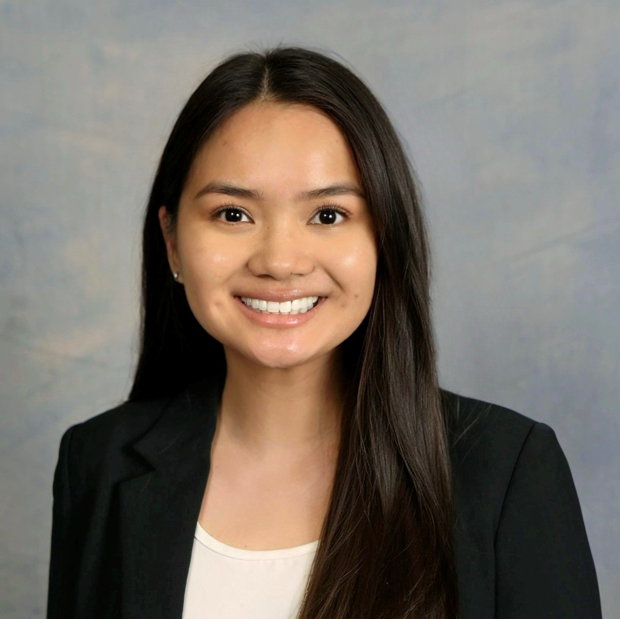 woman in suit smiling