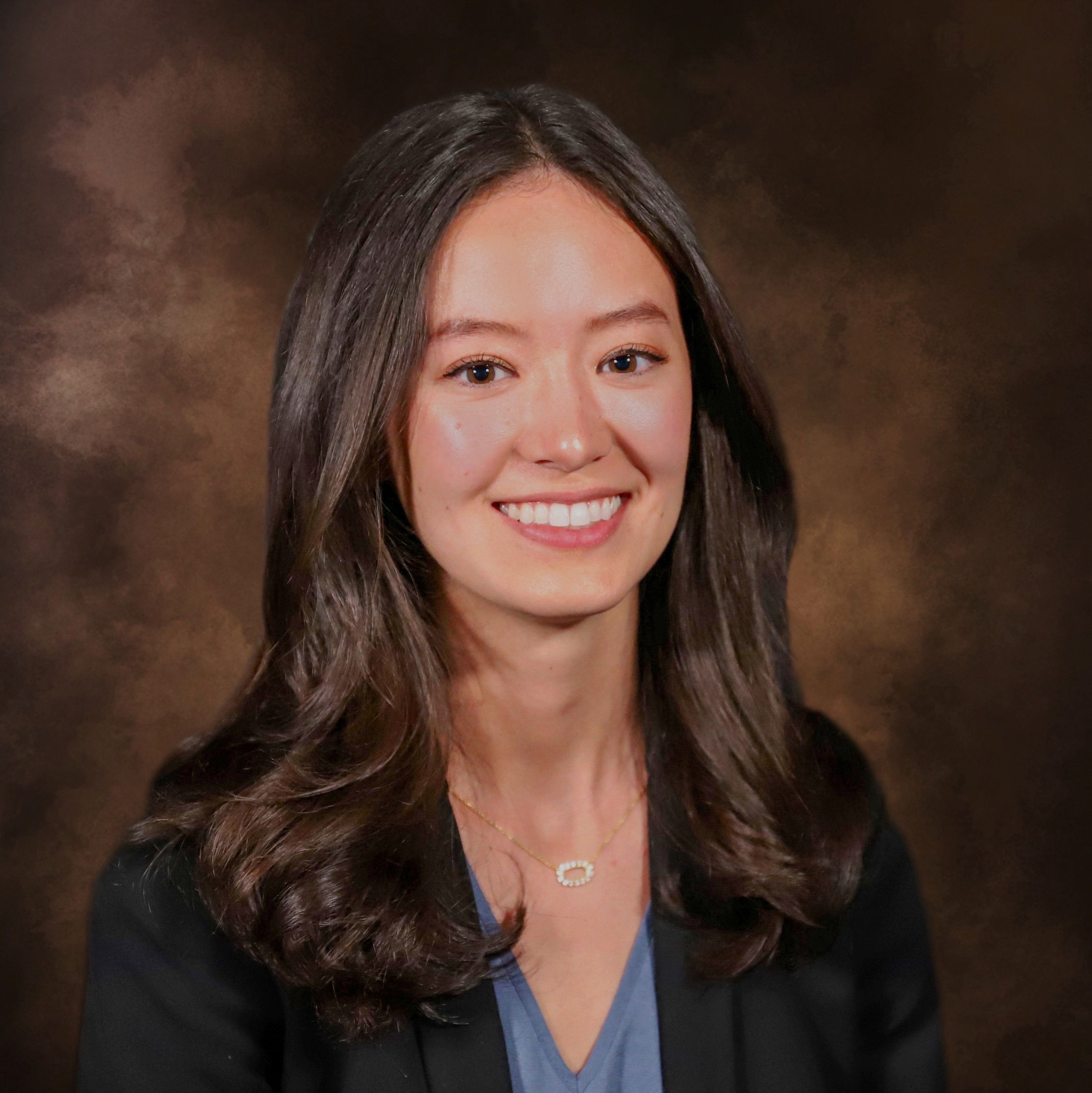 woman in suit smiling