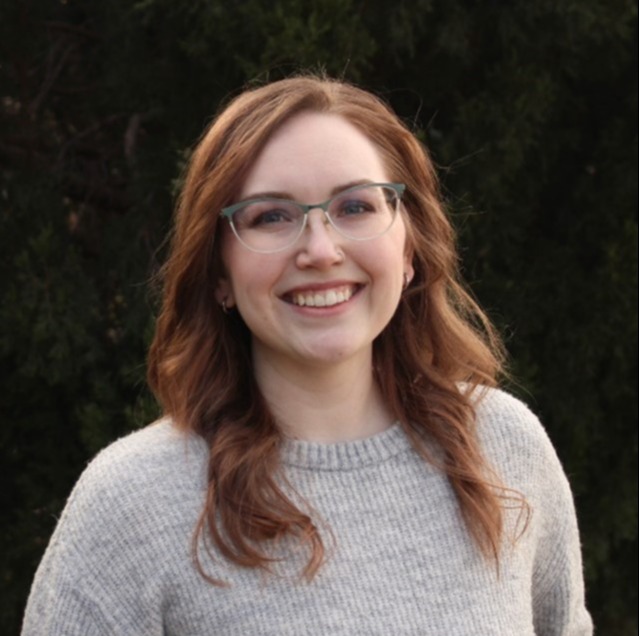 female smiling with glasses on