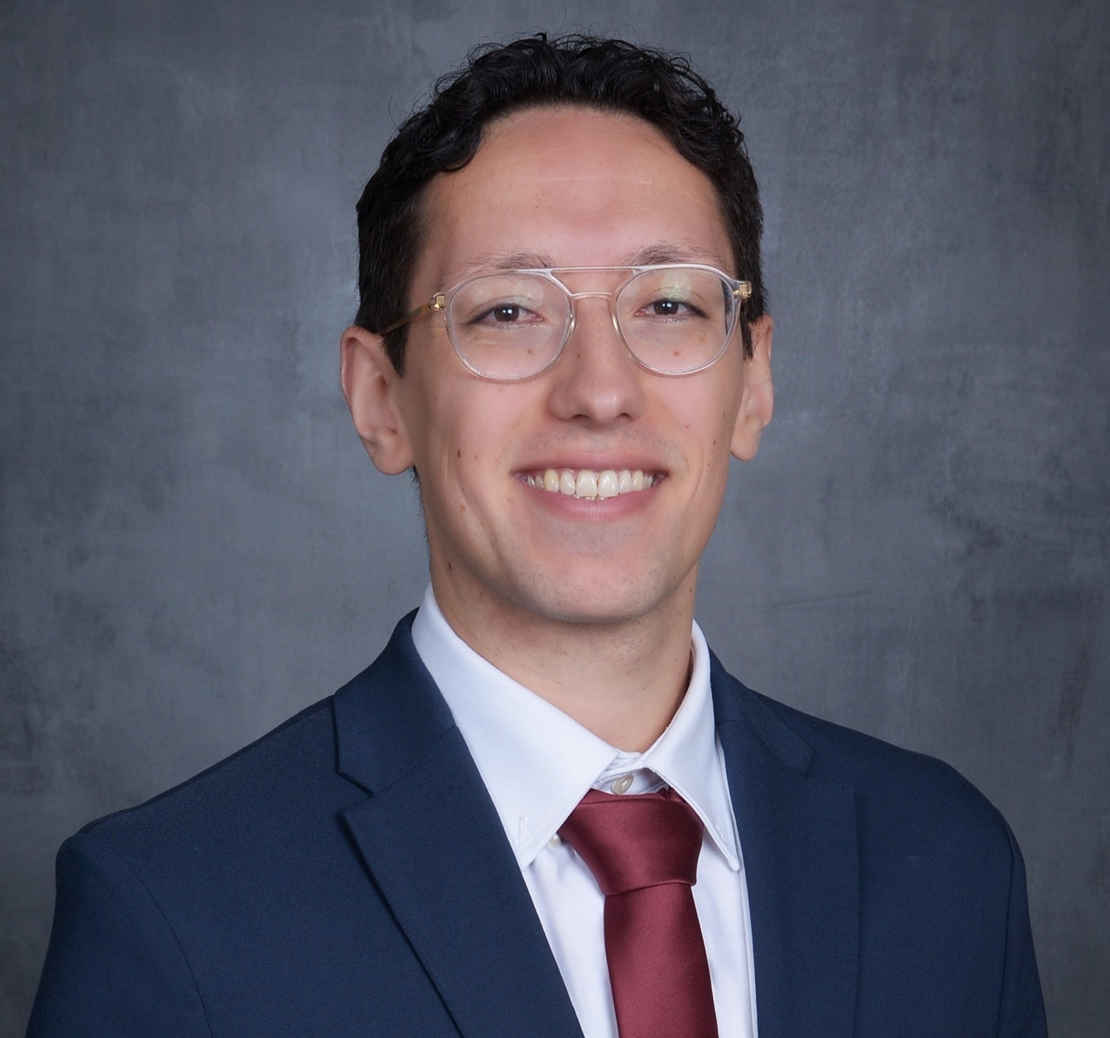 man in a suit smiling
