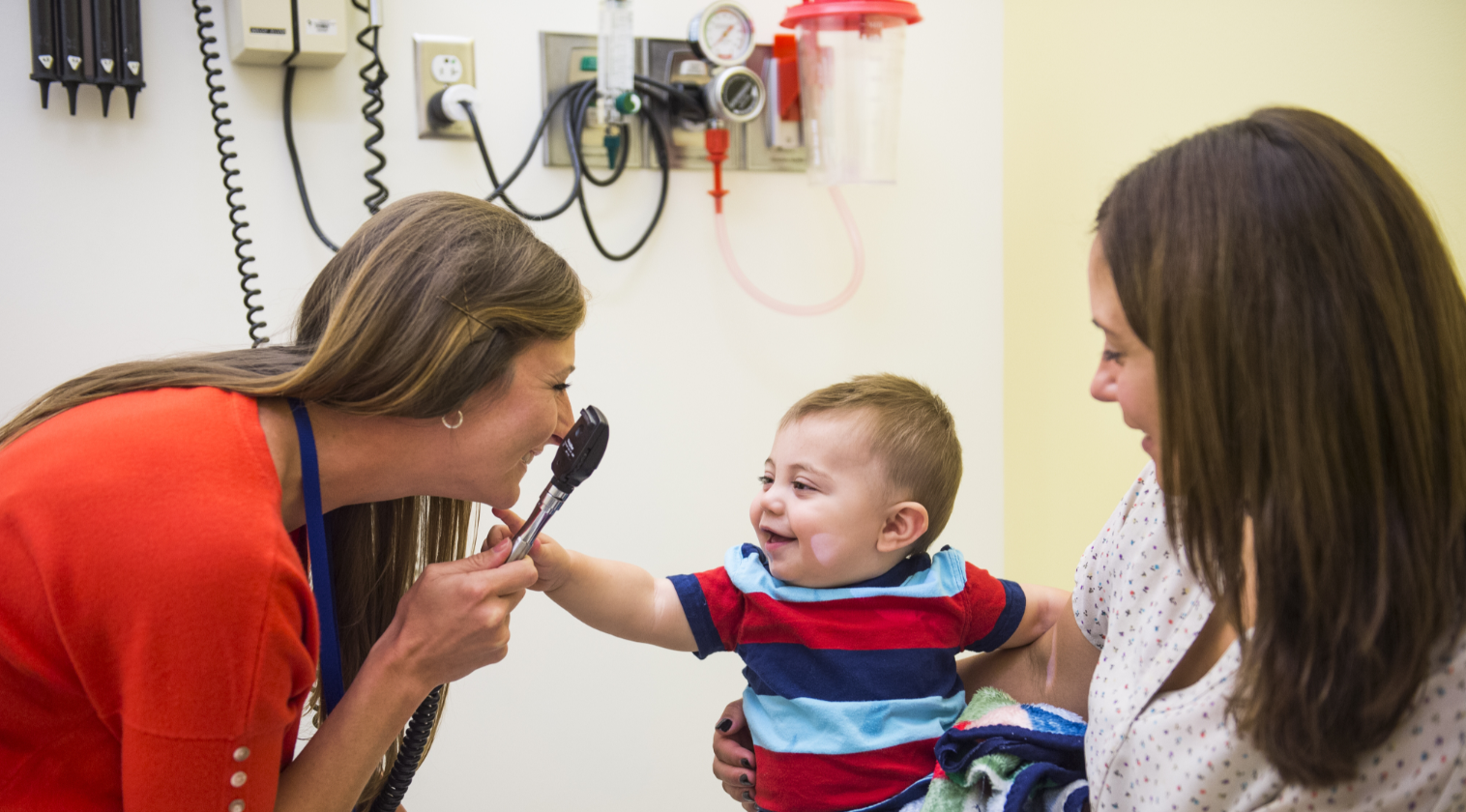 Child being examined by provider