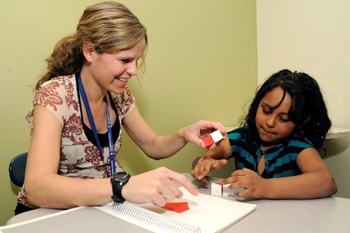 teacher helping student NPsych