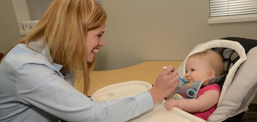 baby-being-fed-in-highchair baby-being-fed-in-highchair