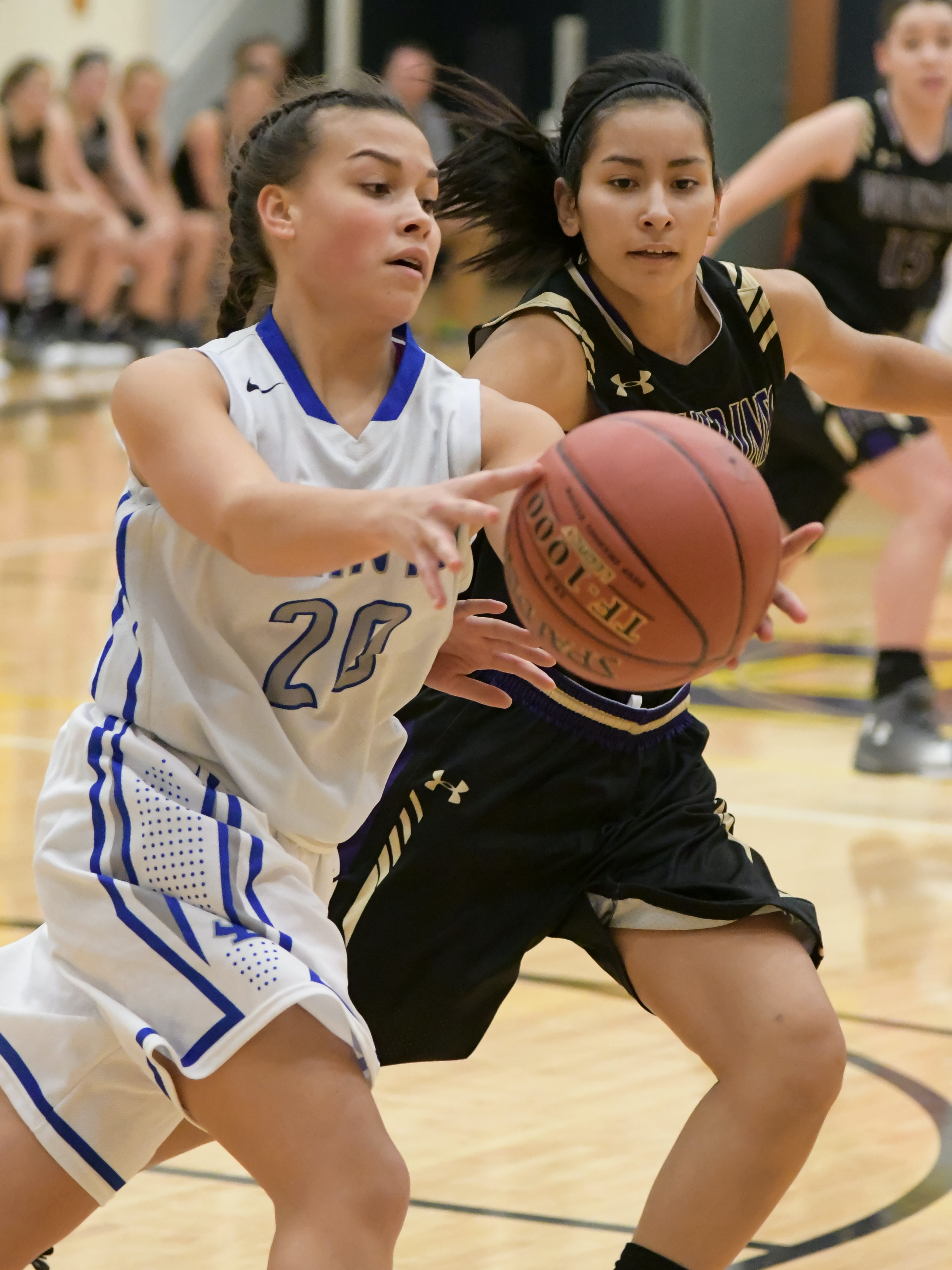 teens playing basketball
