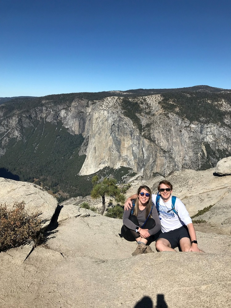 Photo of Lindsay Burke with a man in the mountains.