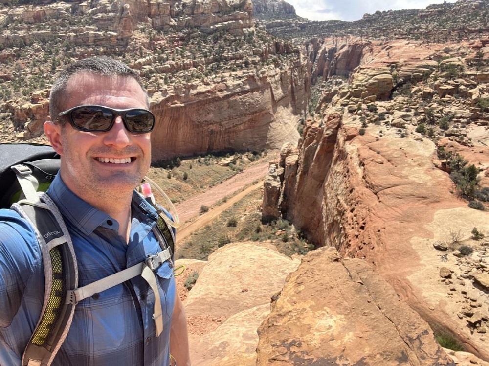 Dr. Hesling hiking in the mountains.