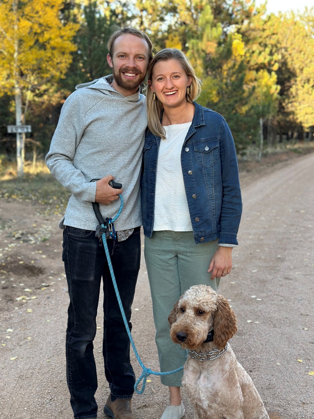 Dr. Stark standing next to a man and a dog.