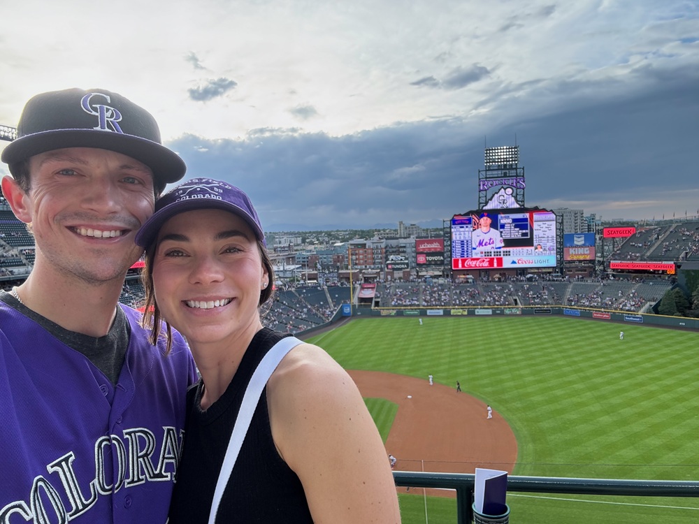 Dr. Kepple pictured with his partner at a Colorado Rockies baseball game.