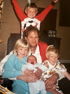 Photo of Dr. Blei shortly after starting at UCHealth, pictured with his young children.