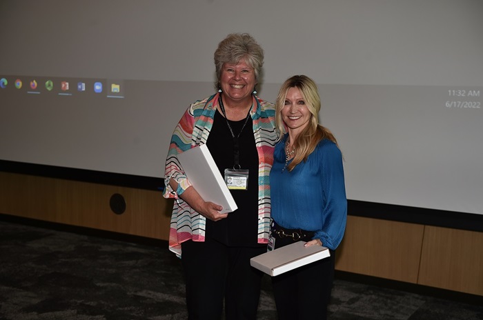 Photo of Drs. Jenny Rodriguez and Joyce Oleszek receiving the Professionalism Award