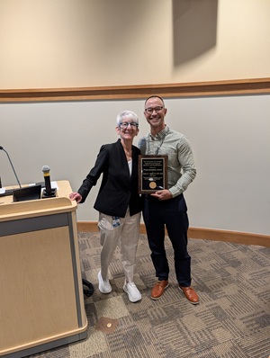 Dr. Andrew Smith receiving the 2026 CU PM&R Professionalism Award.
