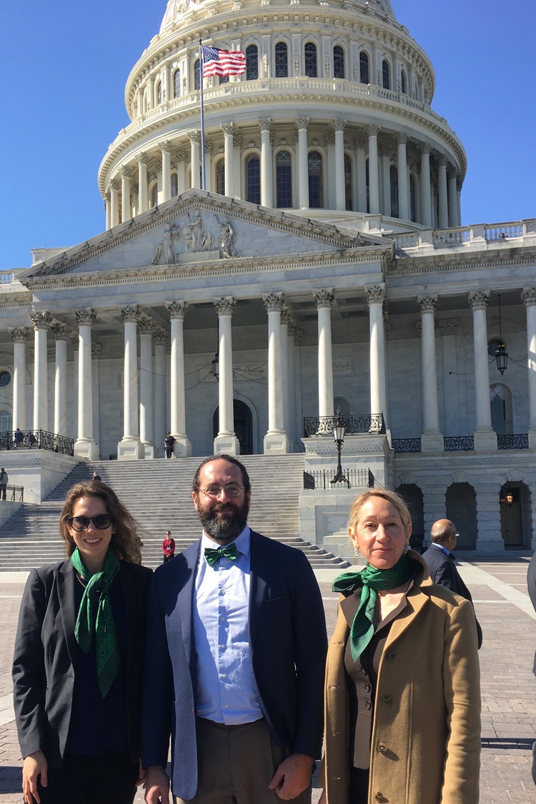 Dr. Baer and two other people standing in front of the United States Capitol Building.