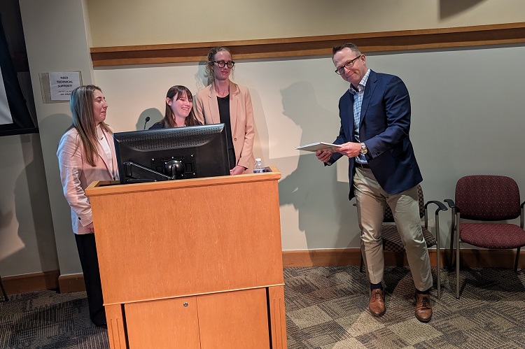 Photo of Dr. Scott Laker receiving service recognition for his time as Residency Program Director.