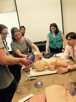 Heather Carmichael teaching incoming interns clinical skills Heather Carmichael teaching incoming interns clinical skills