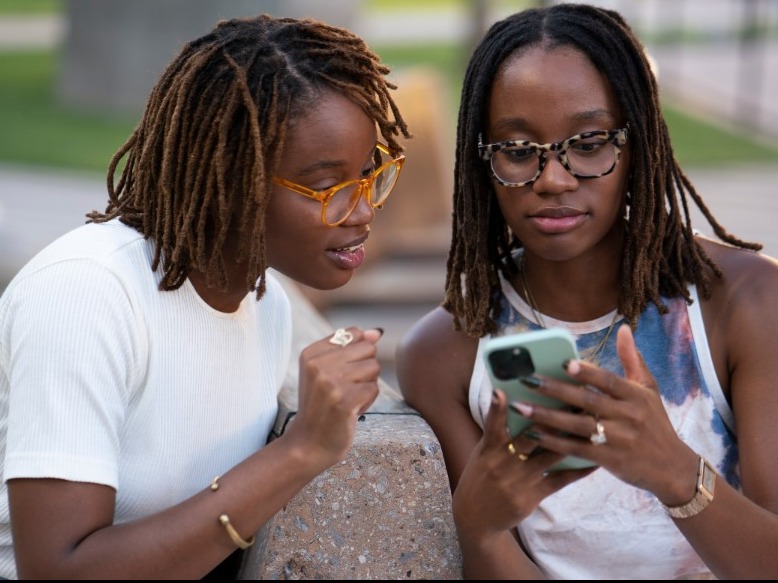 Two people look at social media and read more about health tips that have gone viral.