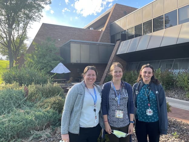 Clinic Sites Team Team members standing outside of the building