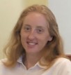 Headshot of women in collared shirt