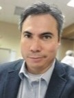 Professional headshot of man in suit