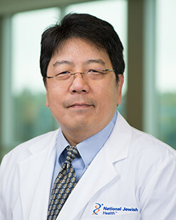 Headshot of man in lab coat