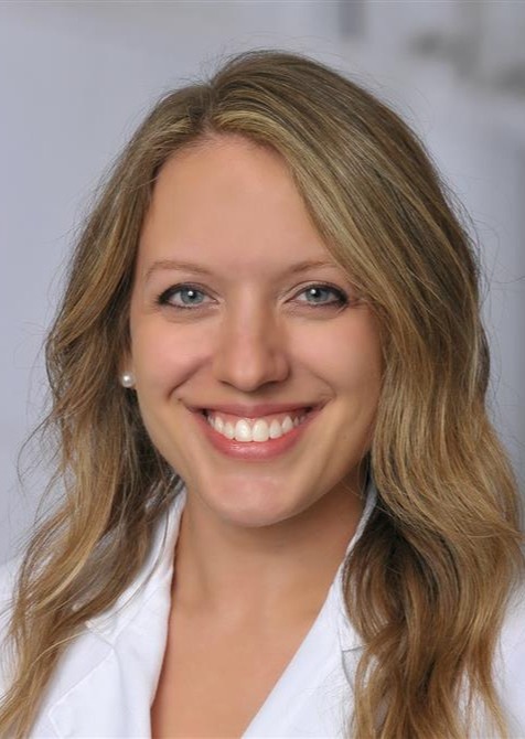 Headshot of a woman in lab coat
