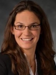 Professional headshot of women in suit jacket