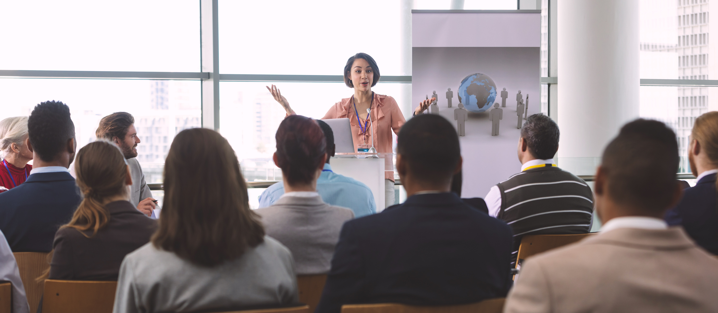 Image of woman presenting to a crowd