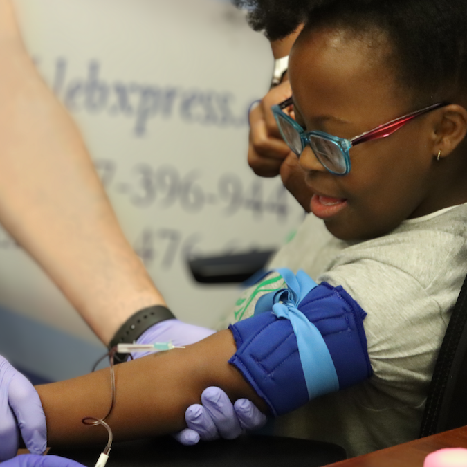 Participant getting her blood drawn for the HTP