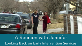 Jennifer walking down a sidewalk with her Mom.