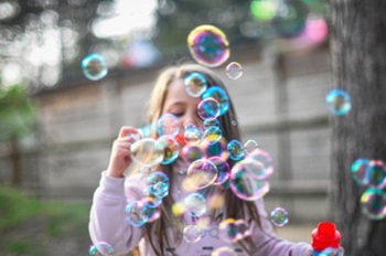 Girl blowing bubbles