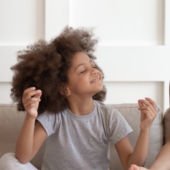 Child doing breathing exercise