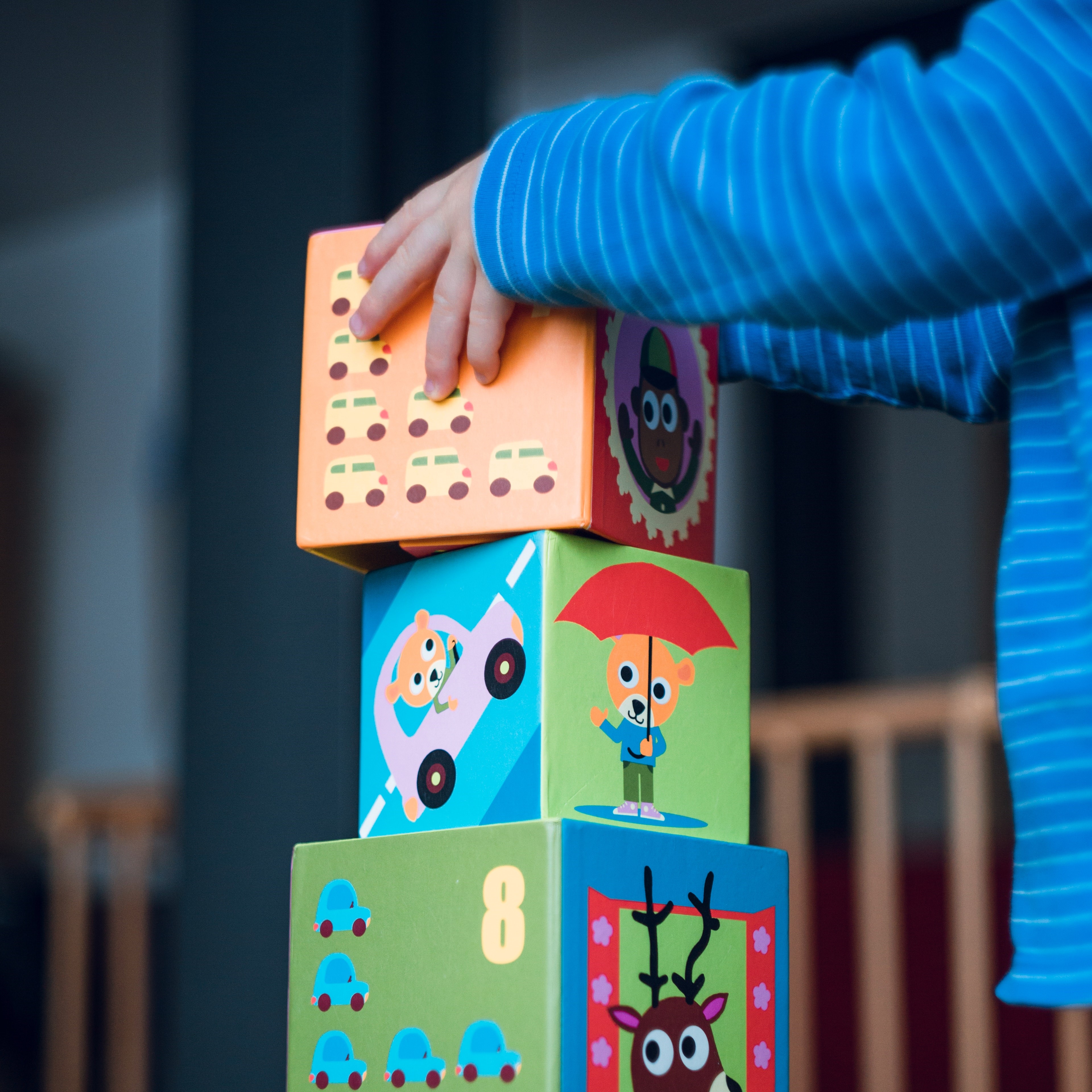 Kid stacking blocks